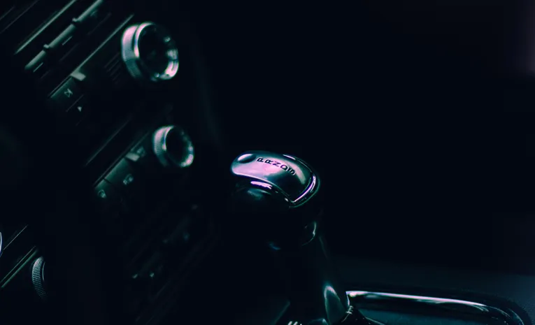Close-up of an automatic gear shifter representing gearbox mechanics