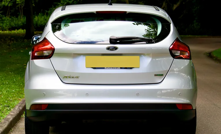 Silver Ford Focus hatchback parked on a UK street