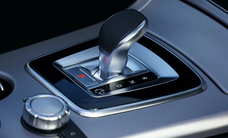 Close up of an automatic gear shift stick inside a modern car