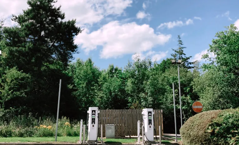 Electric vehicle charging station in nature on a sunny day