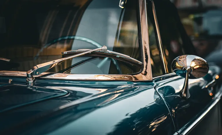Close-up of classic vintage car chrome details and reflections