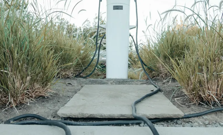 Electric vehicle charging station in a green outdoor setting