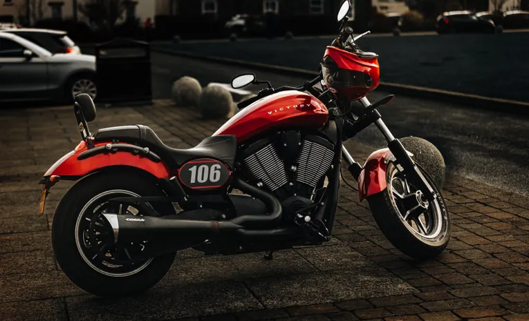 Red and black sports motorcycle parked on the street