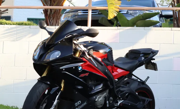 Black and red sport motorcycle parked outdoors showing motorcycle types